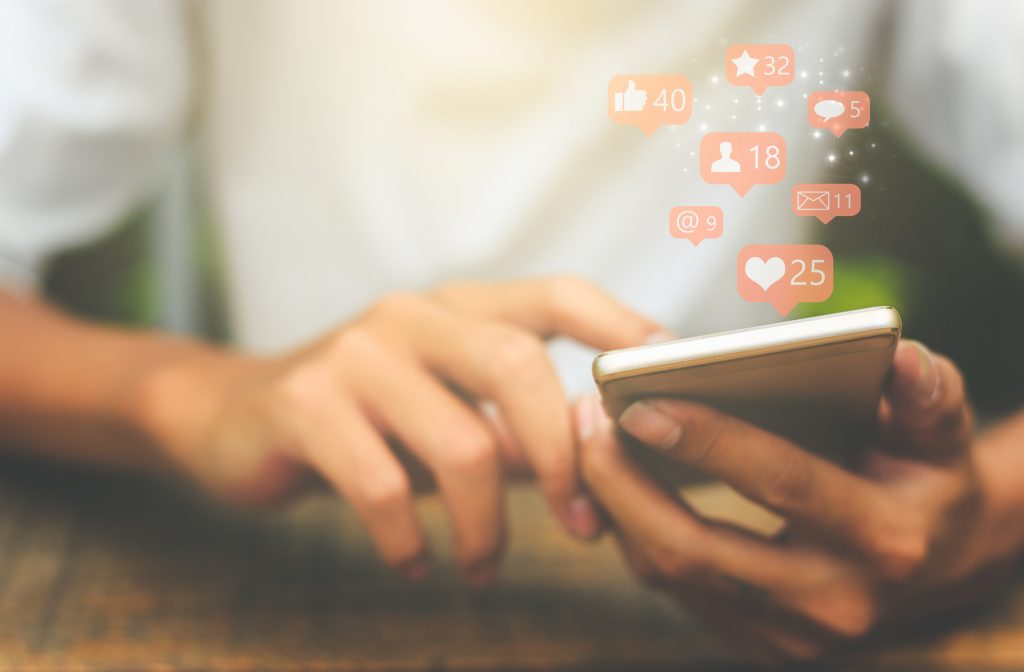 Social media notifications coming out of phone
